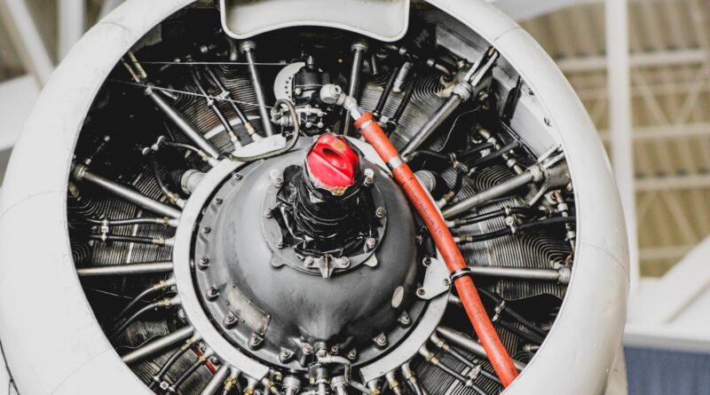 closeup photo of gray and white engine part